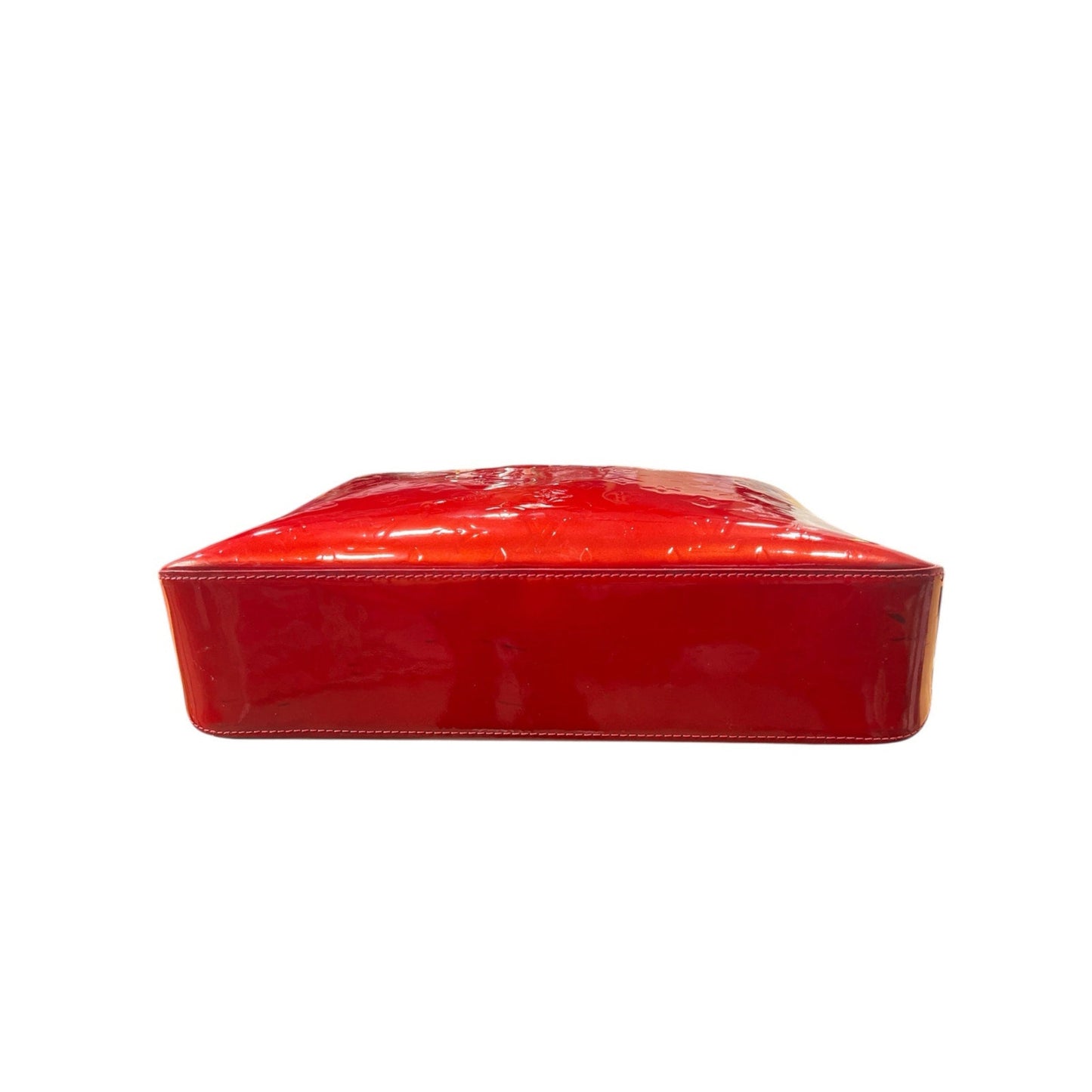 Red rectangular box with a glossy finish on a white background