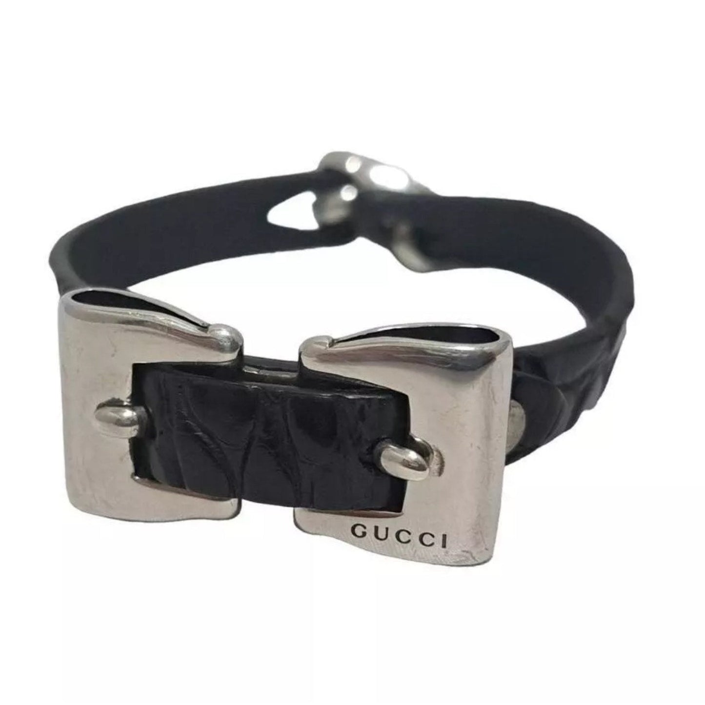 Black leather Gucci bracelet with silver clasp on a white background