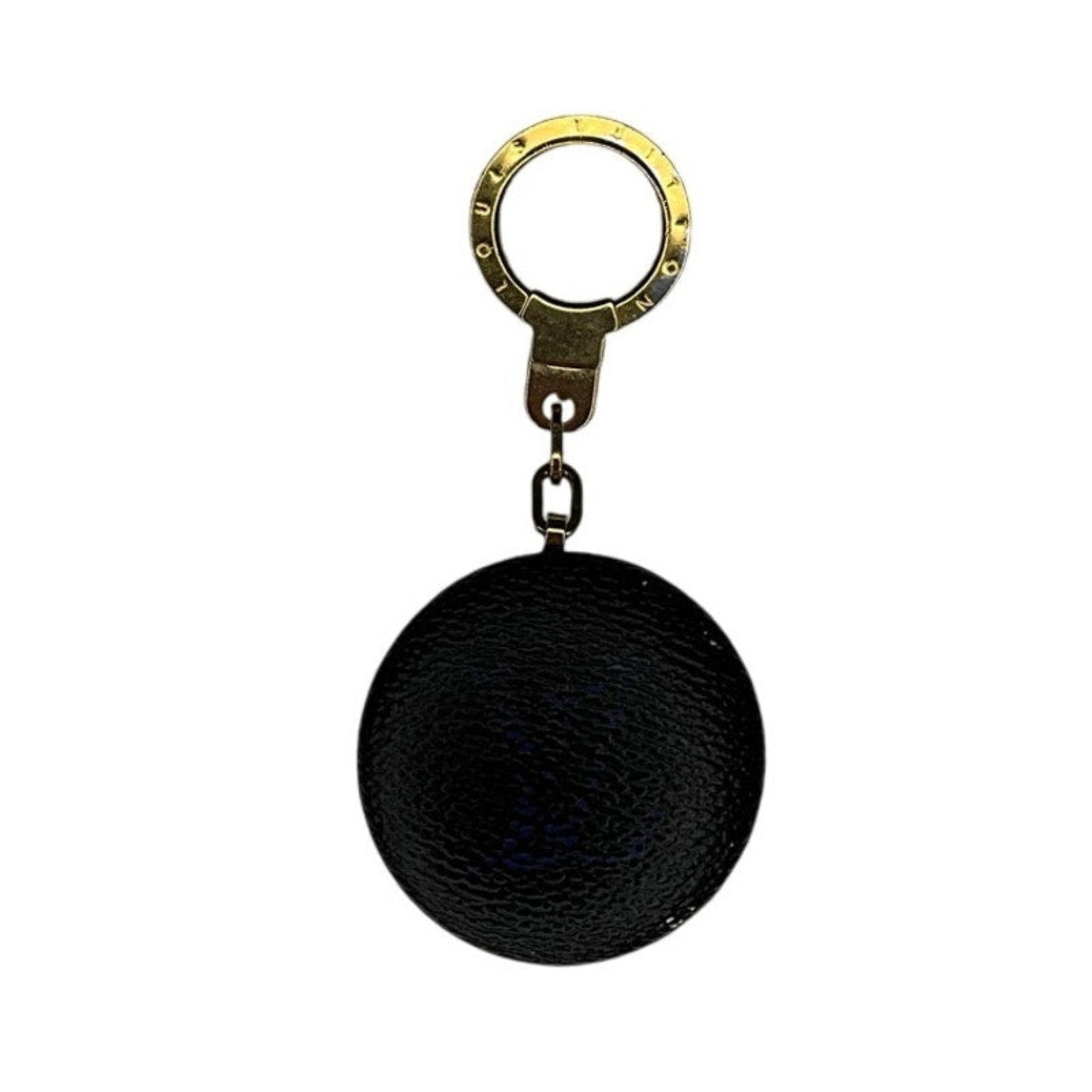 Black spherical keychain with a gold ring on a white background