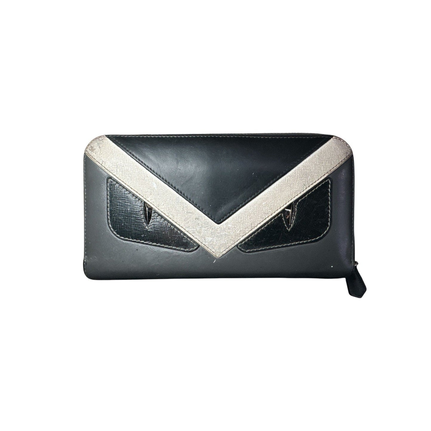 Black clutch bag with a white V-shaped design on a white background