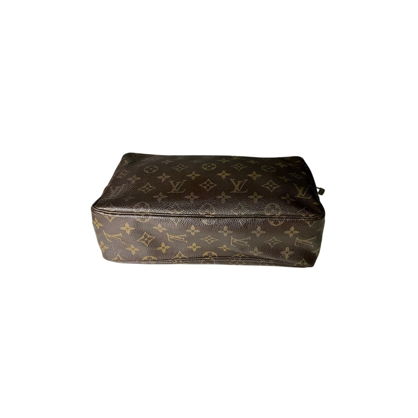 Brown leather pouch with monogram pattern on a white background