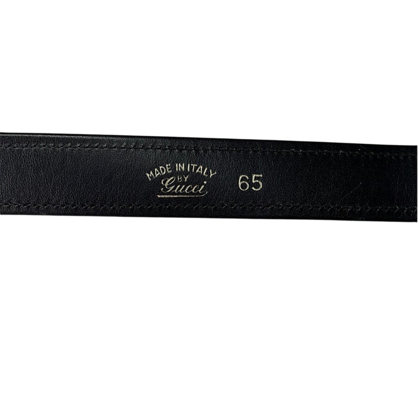 Black leather belt with 'Made in Italy by Gucci' engraving on a white background