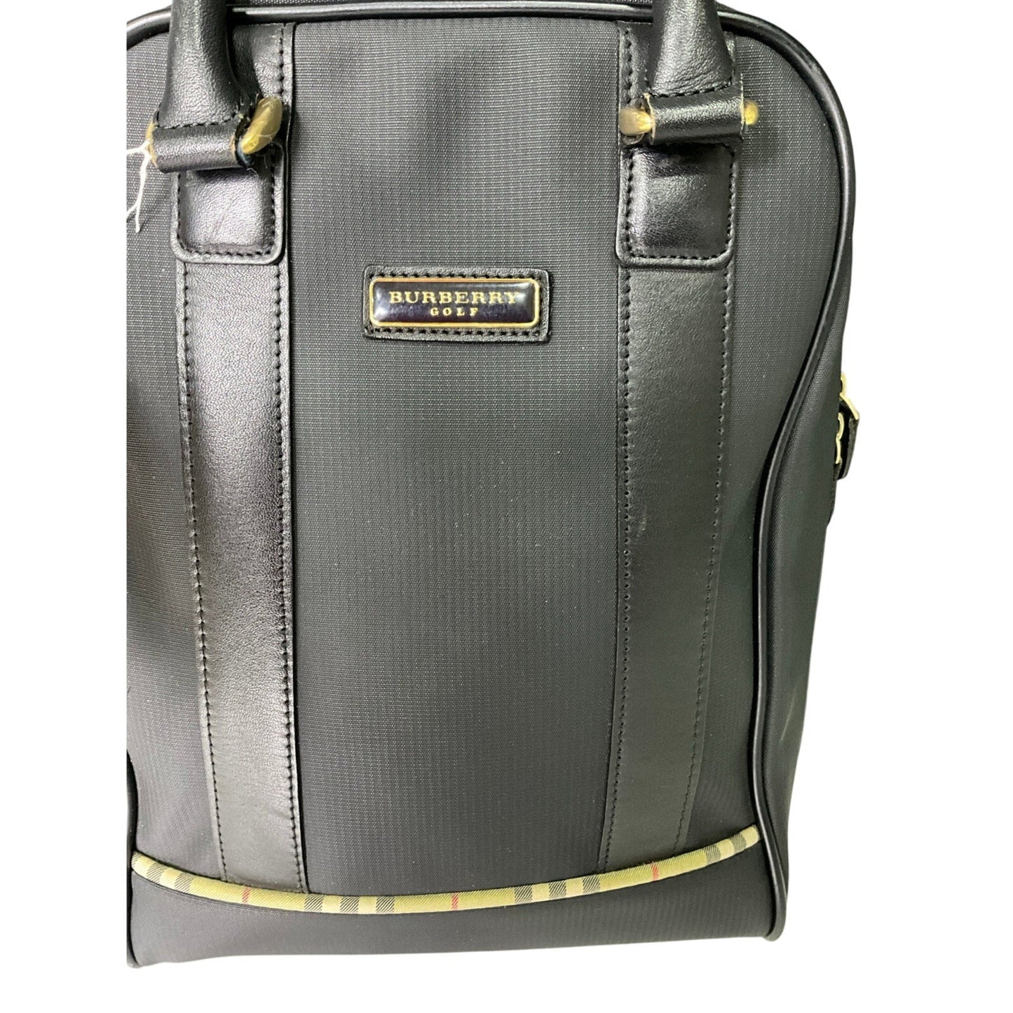 Gray Burberry bag with gold accents on a white background