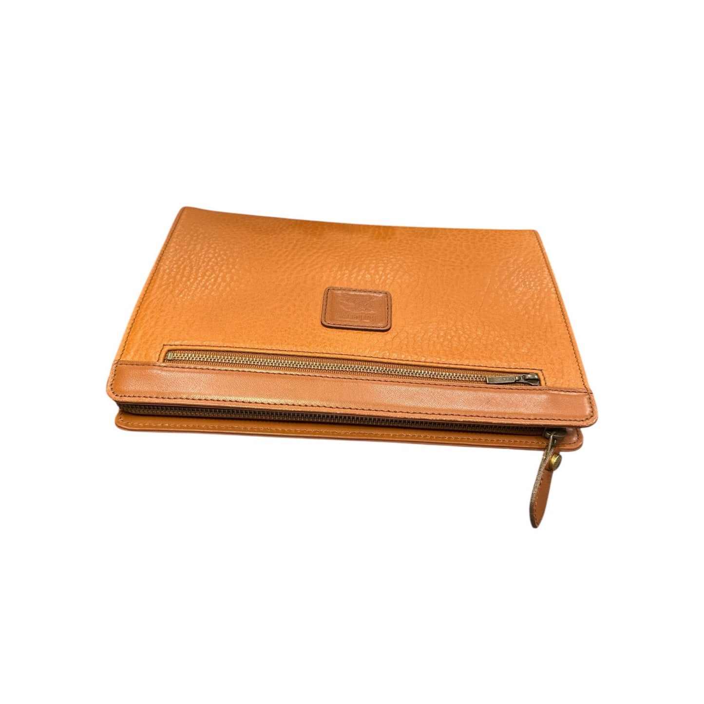 Orange leather clutch bag with a gold zipper on a white background