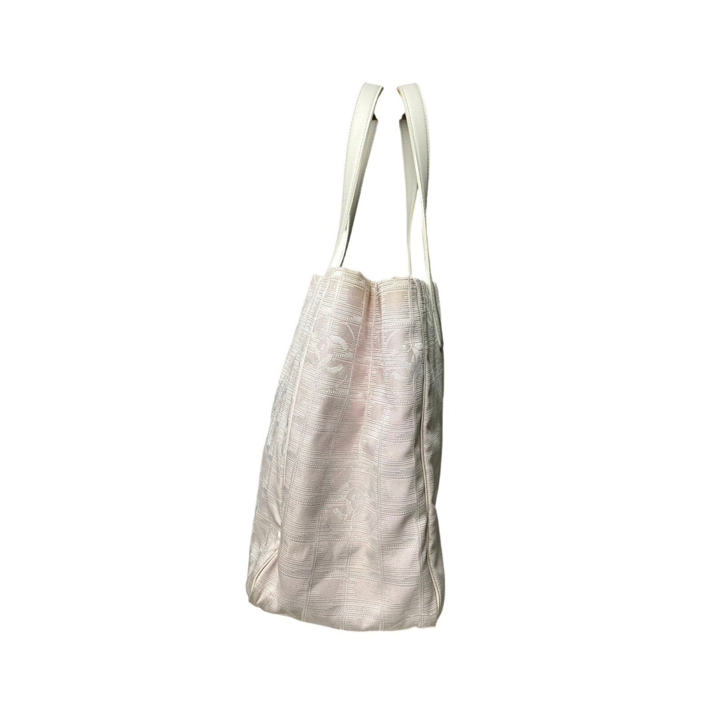 Light-colored tote bag with straps on a white background