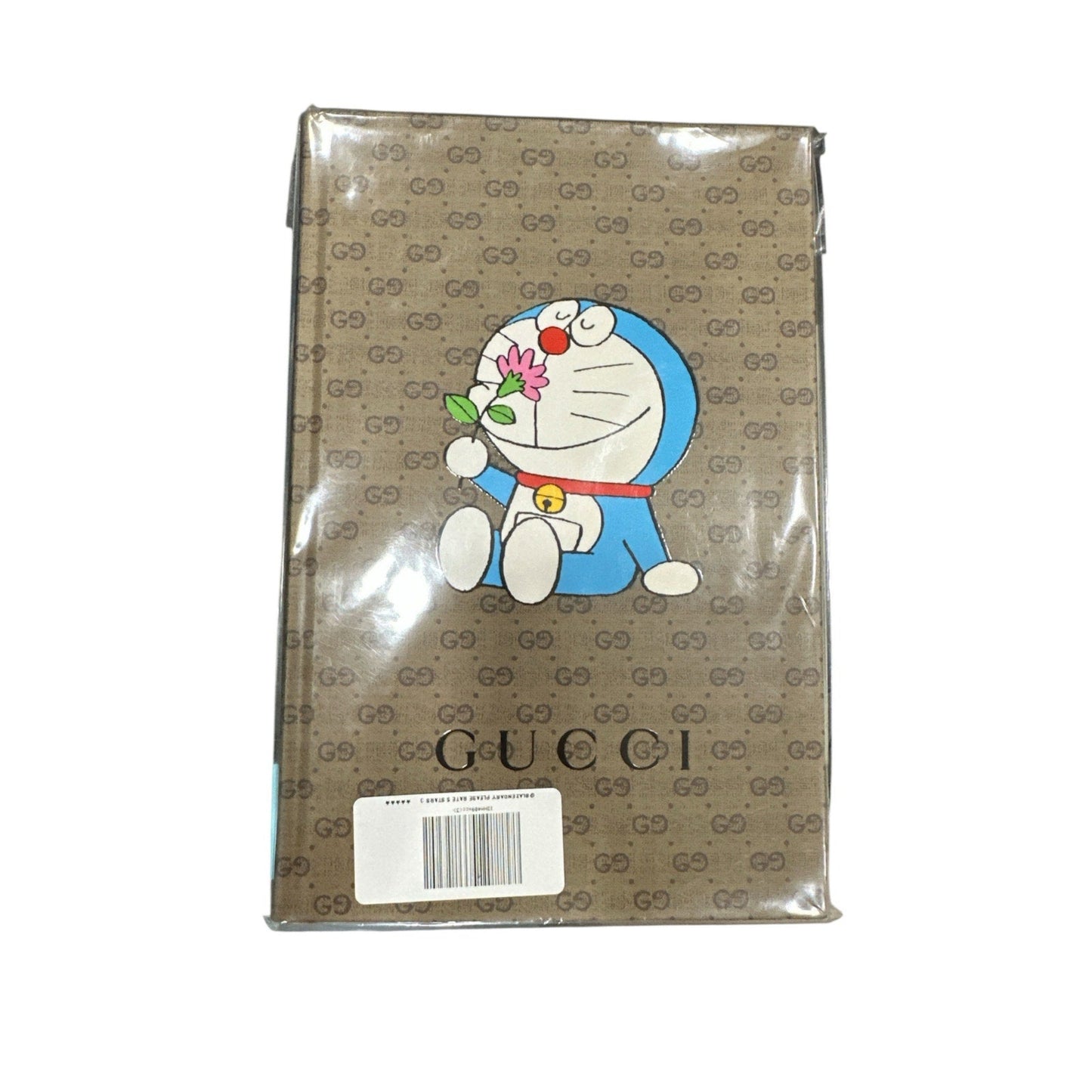 Packaged product with cartoon character and Gucci logo on a beige background
