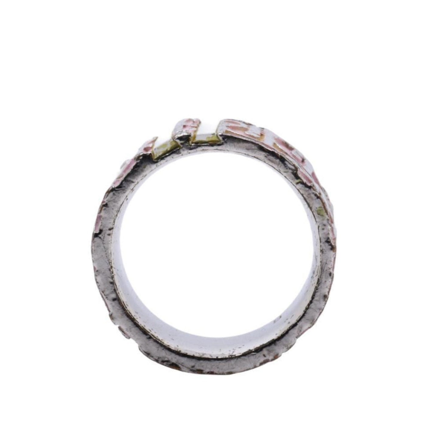 Close-up of a metallic ring with a white background