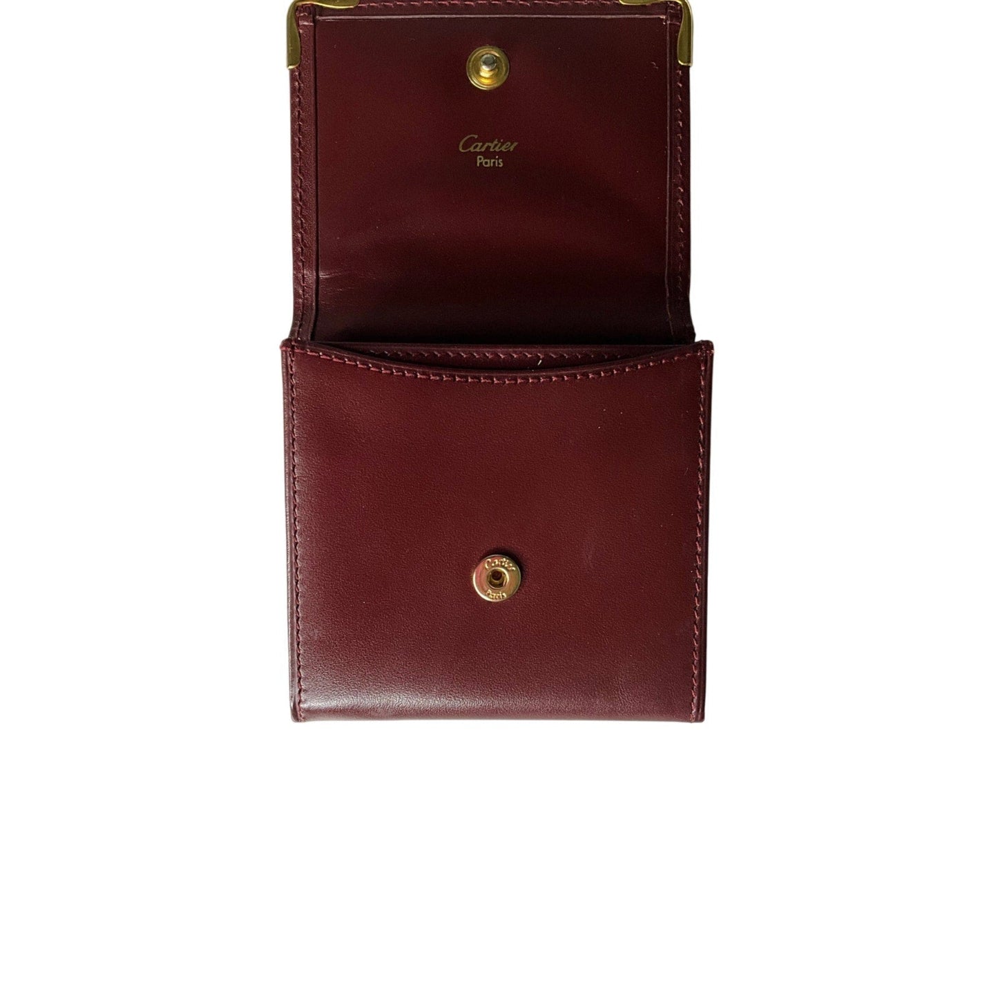 Brown leather wallet with gold accents on a white background