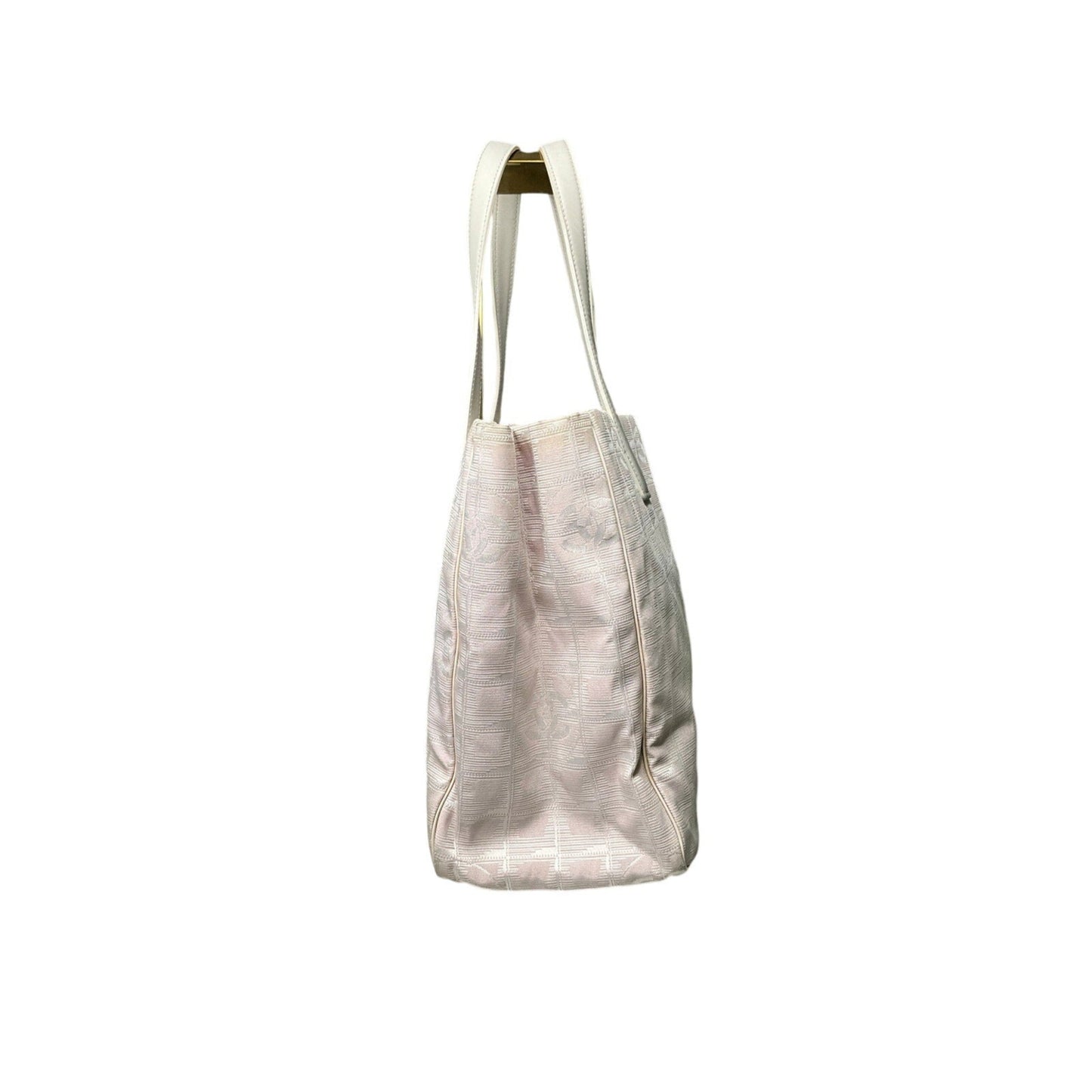 Beige tote bag with a textured pattern on a white background
