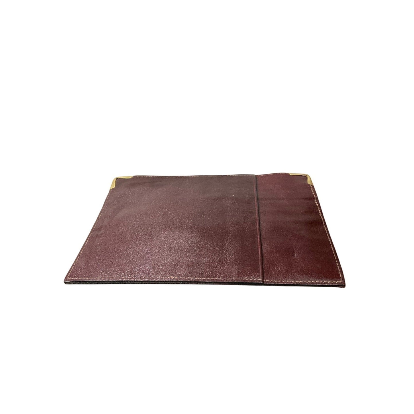 Brown leather pouch with a gold zipper on a white background