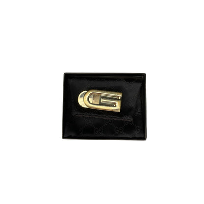 Gold logo on a black textured box