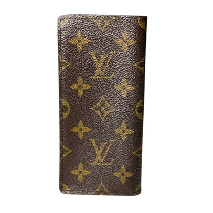 Brown wallet with gold monogram pattern on a white background