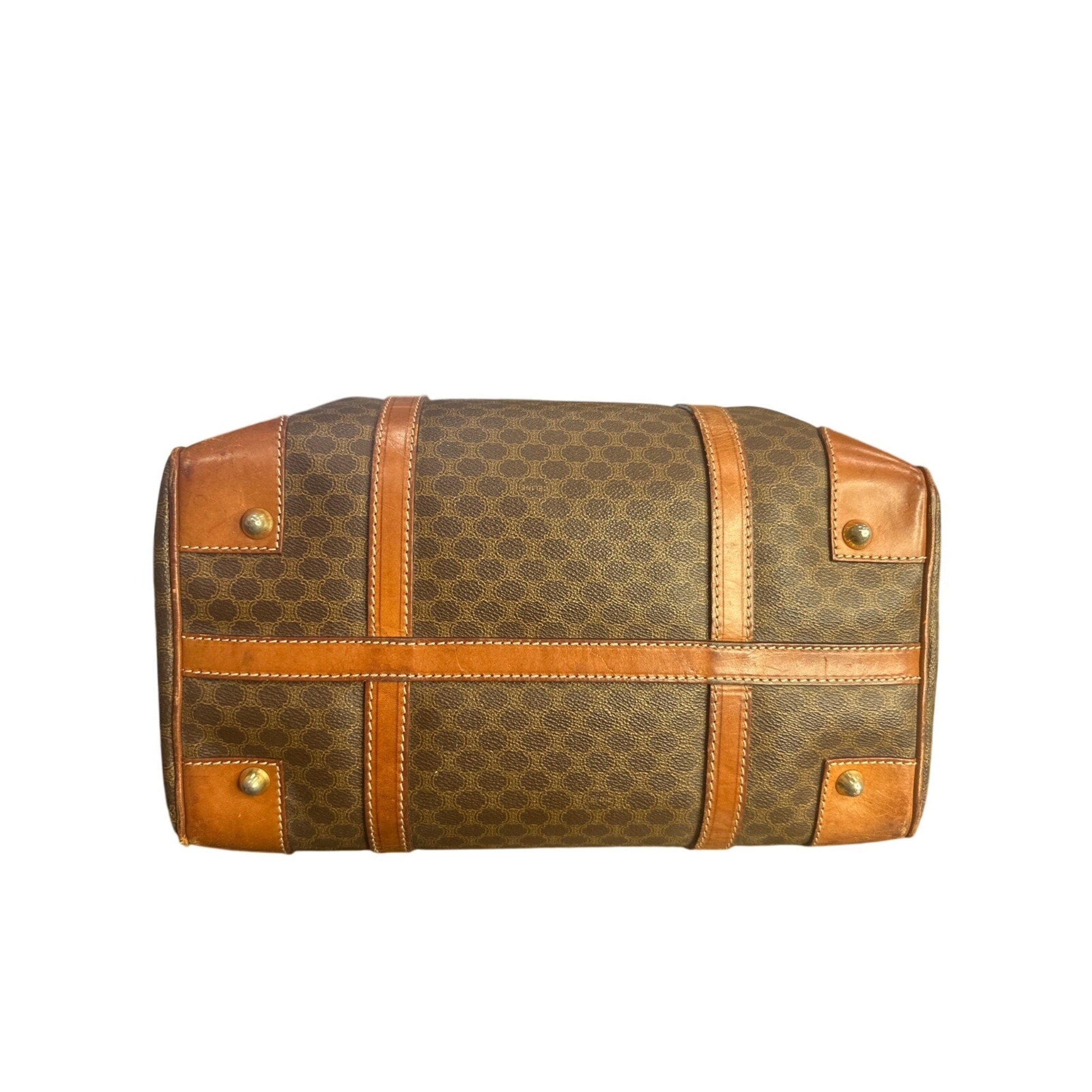 Brown patterned bag with gold accents on a white background