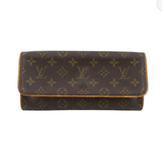 Brown monogram patterned wallet on a white background