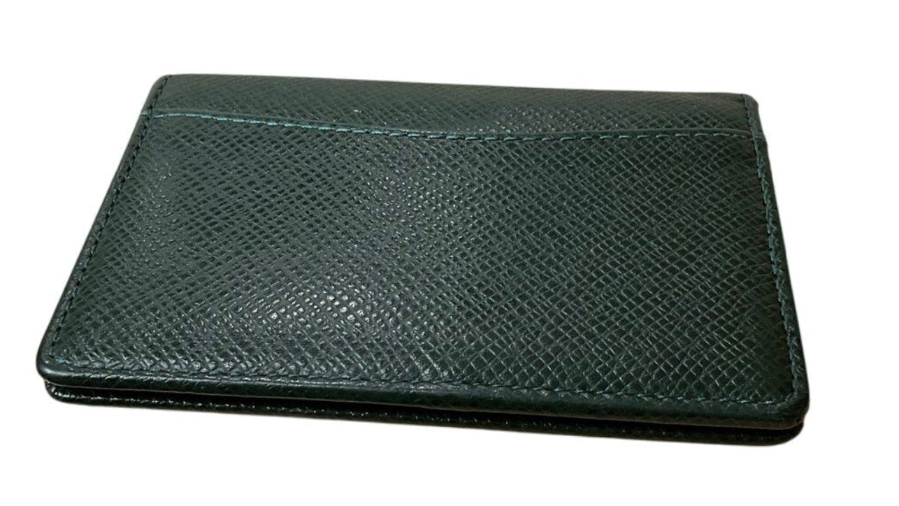 Green leather wallet on a white background