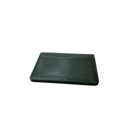 Green leather wallet on a white background