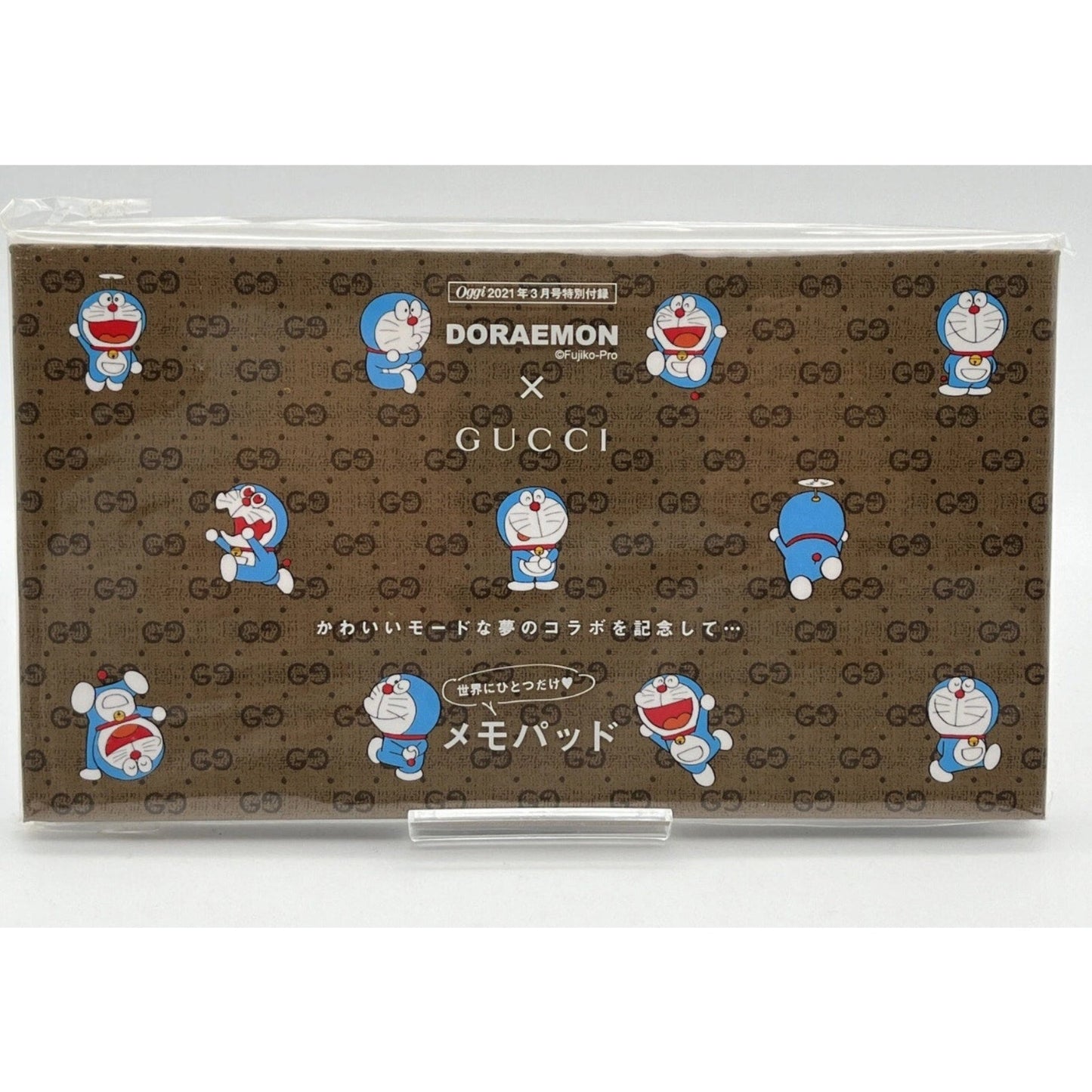 Gucci x Doraemon collaboration product packaging with Gucci logo and Doraemon character.