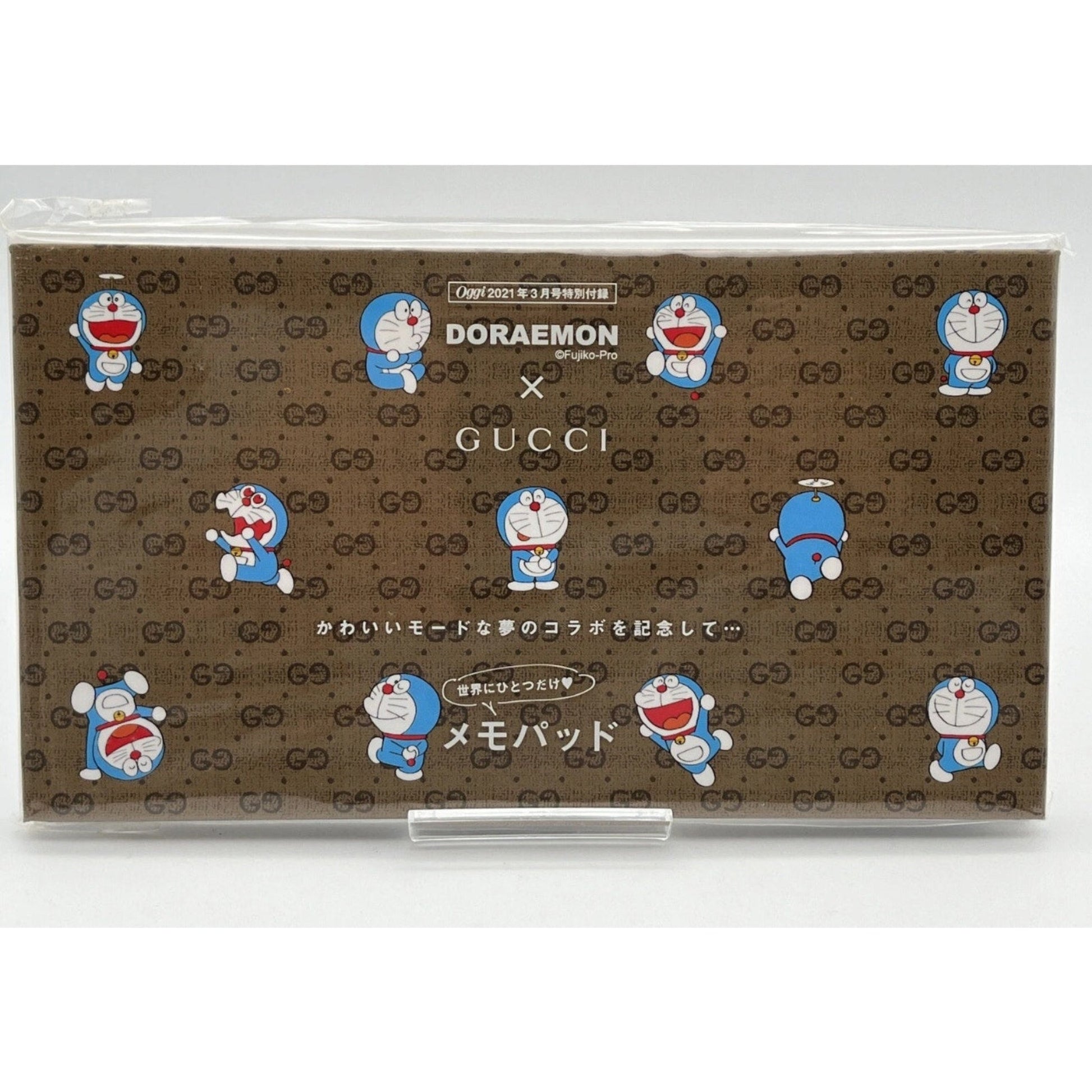 Gucci x Doraemon collaboration product packaging with Gucci logo and Doraemon character.
