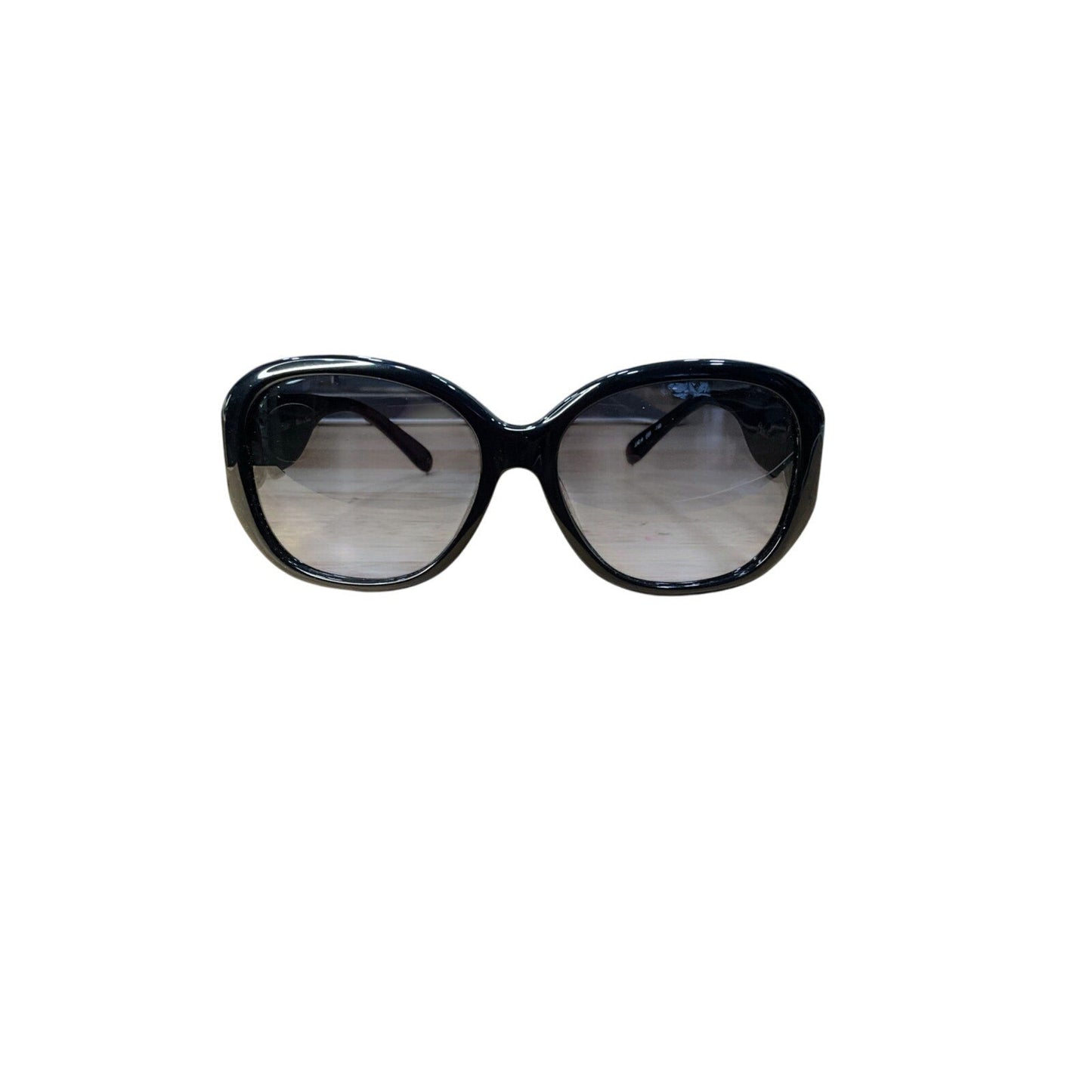Black sunglasses with reflective lenses on a white background