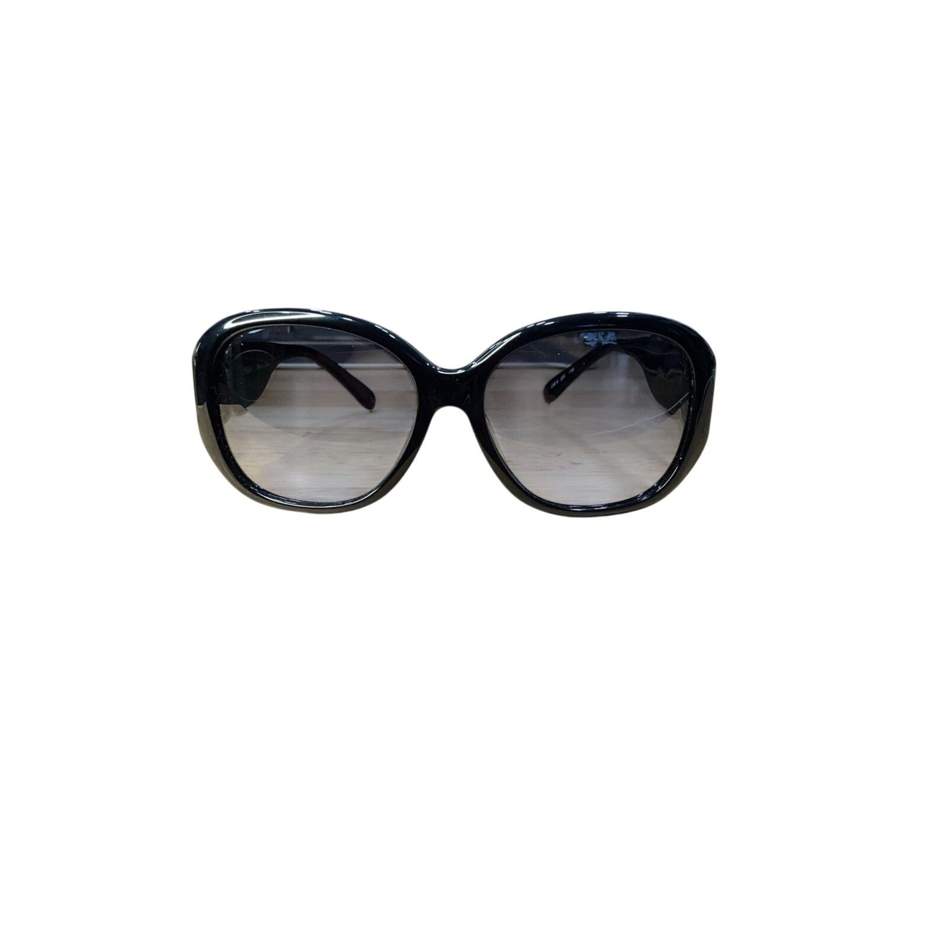 Black sunglasses with reflective lenses on a white background