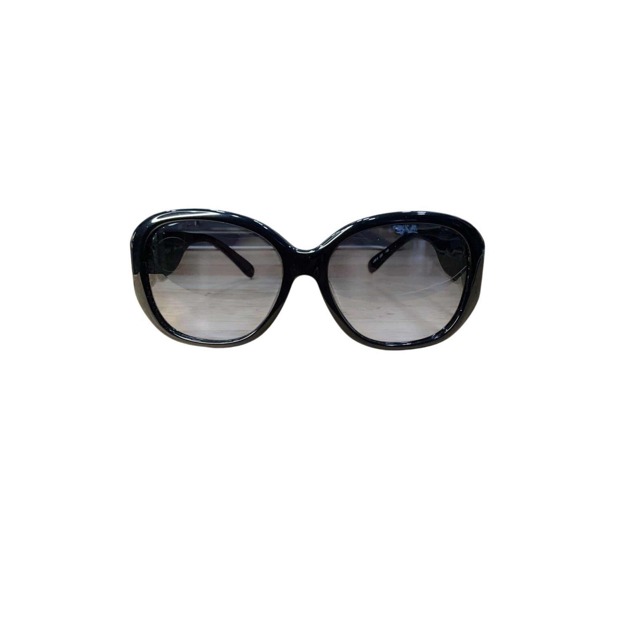 Black sunglasses with reflective lenses on a white background