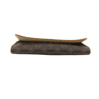 Louis Vuitton wallet with monogram pattern on a white background