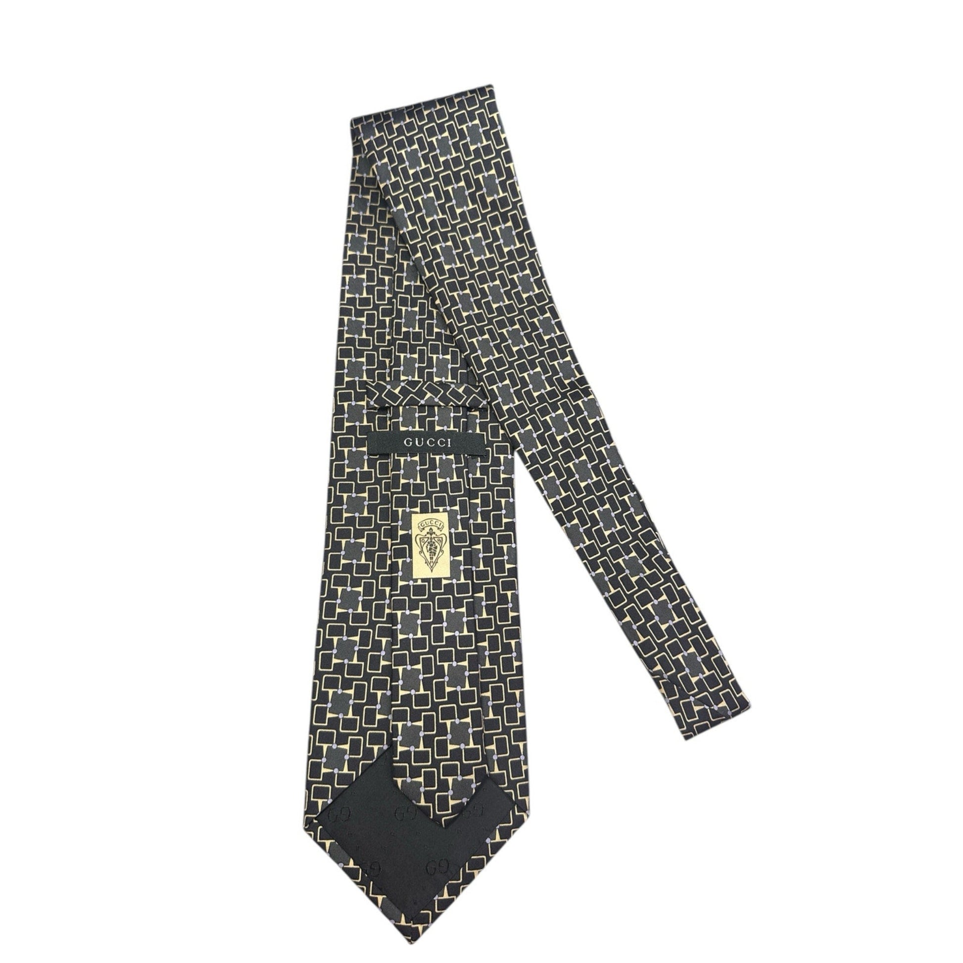 Black patterned tie with Gucci logo on a white background