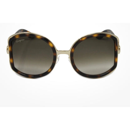 Sunglasses with tortoiseshell frame and gradient lenses on a white background