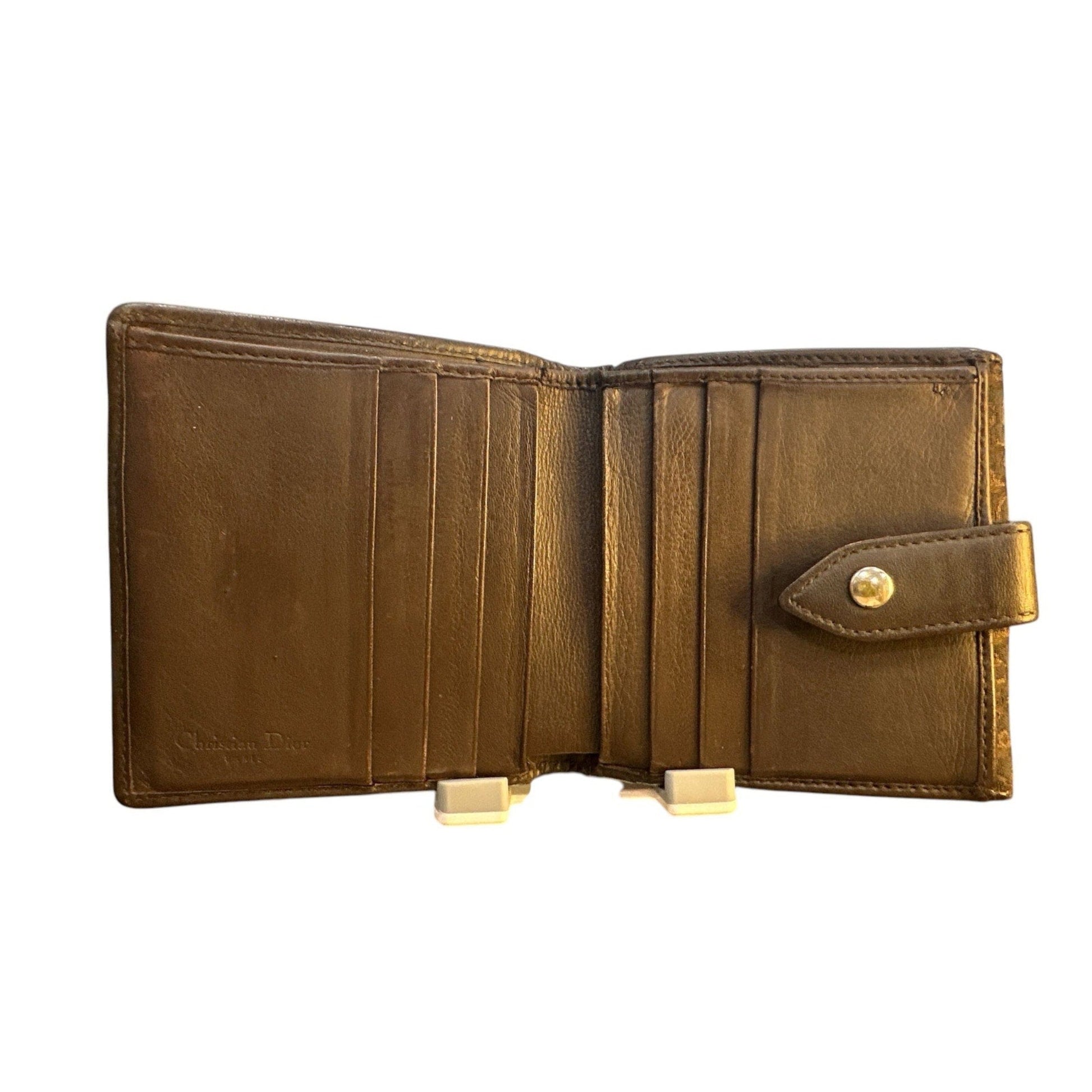 Brown leather wallet with a gold clasp on a white background