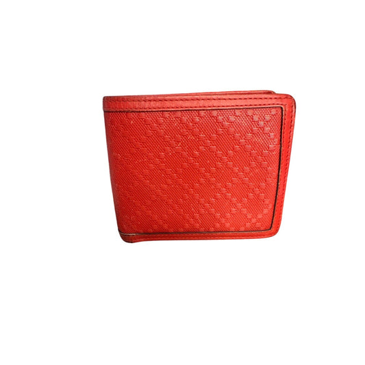 Red textured wallet on a white background