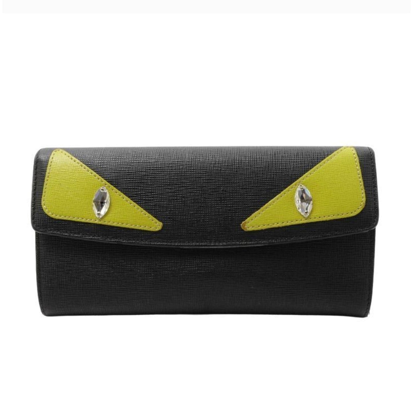 Black clutch bag with yellow accents and gemstone-like decorations on a white background