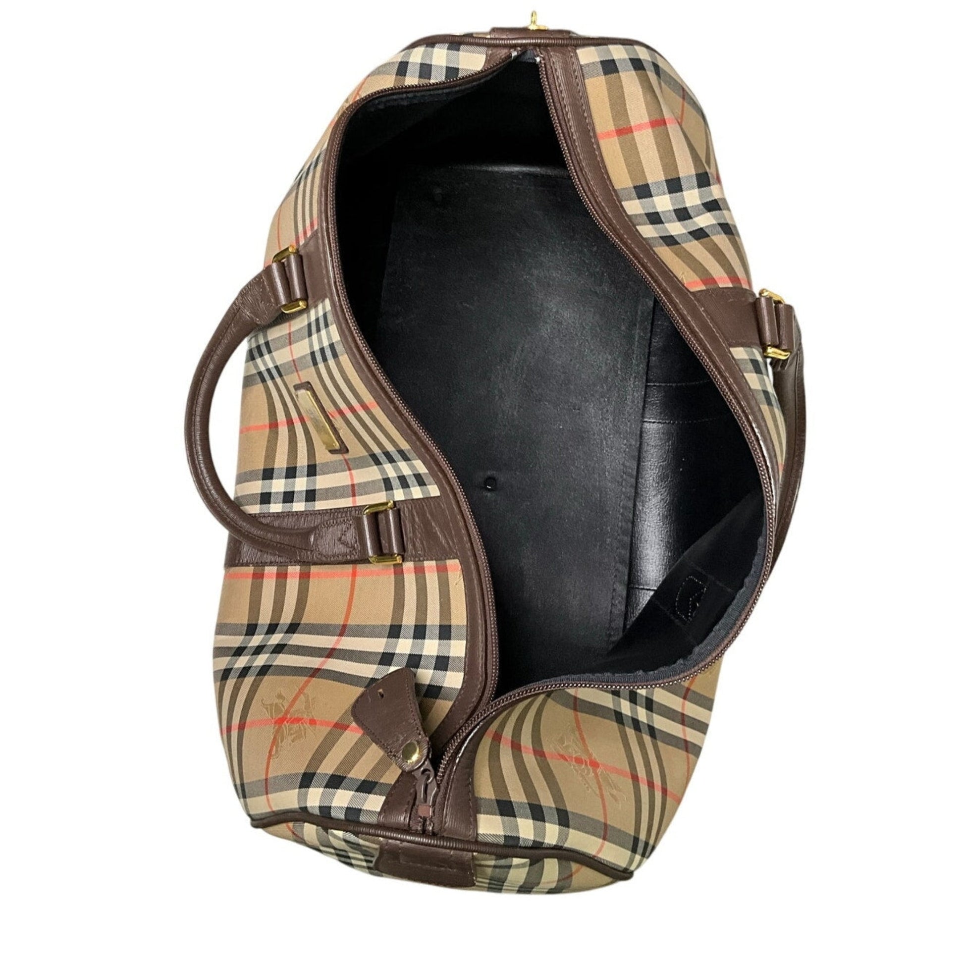 Plaid patterned bag with brown leather accents on a white background