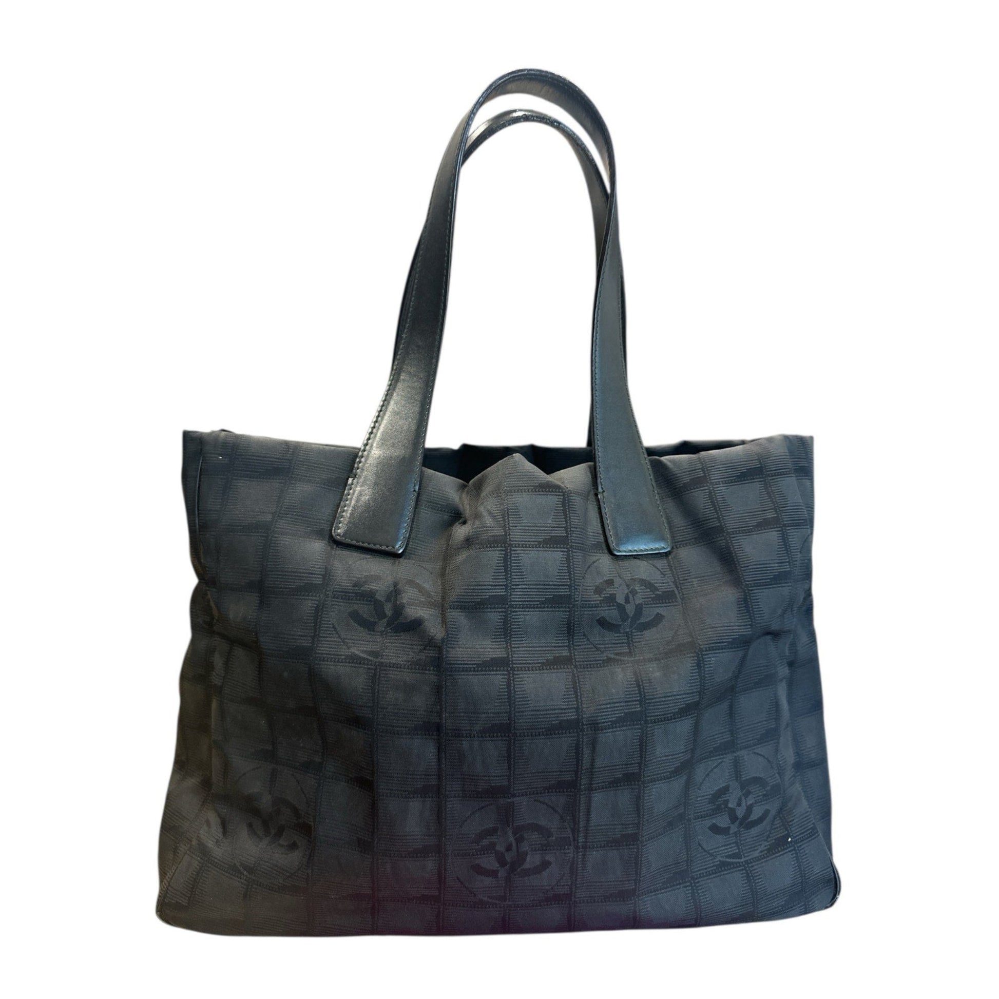 Black textured handbag with a visible brand logo on a white background