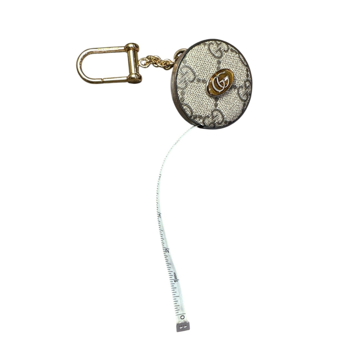 Retractable tape measure with decorative case on a white background