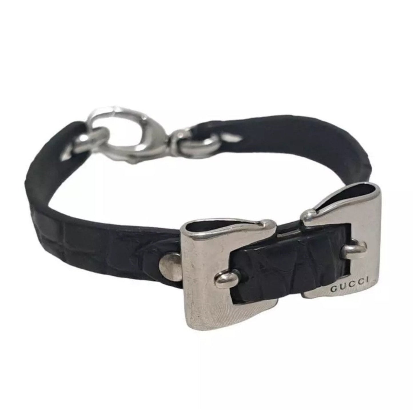 Black leather dog collar with silver hardware on a white background