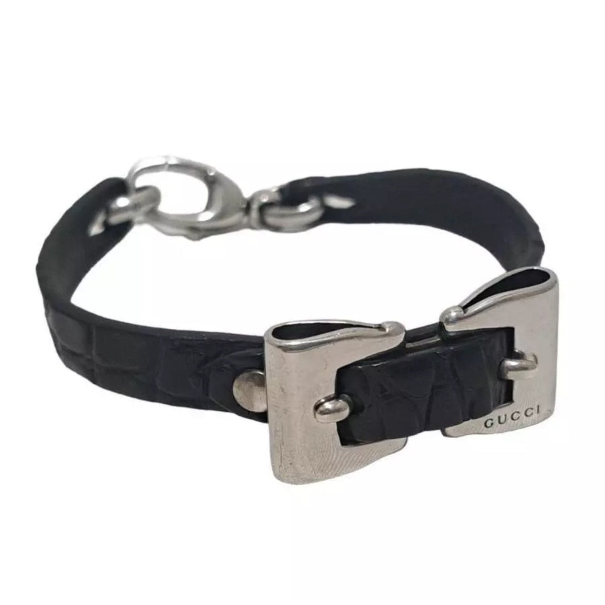 Black leather dog collar with silver hardware on a white background