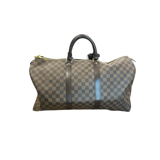 Checkered patterned handbag on a white background