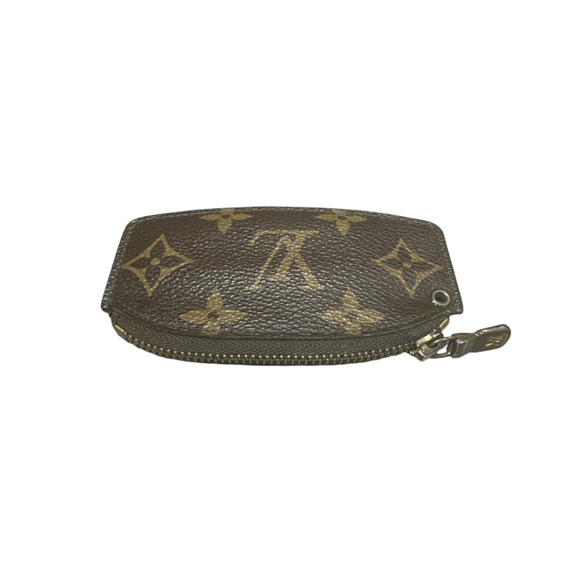 Brown leather wallet with gold monogram pattern on a white background