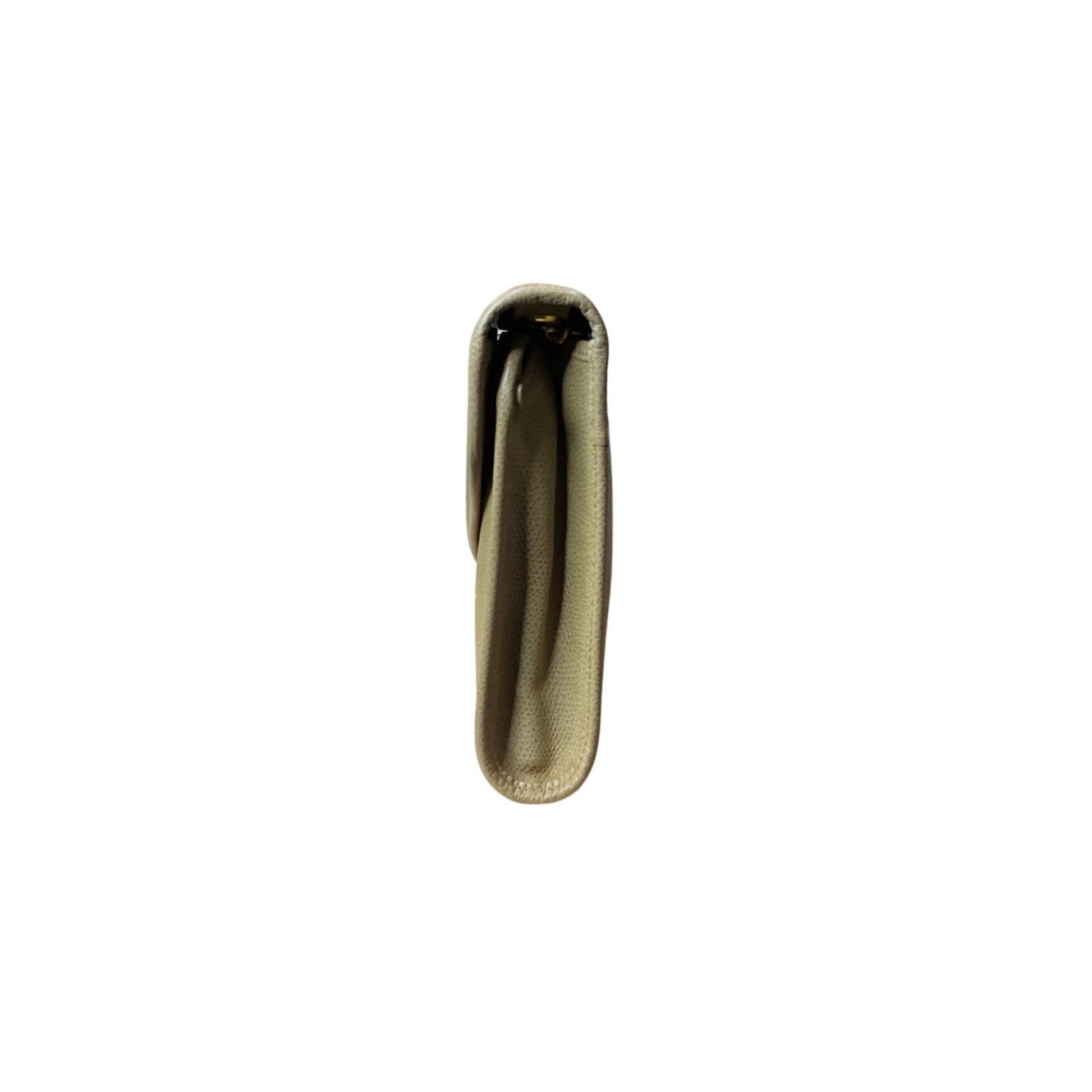 Gold hoop earring on a white background