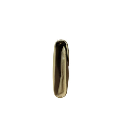Gold hoop earring on a white background