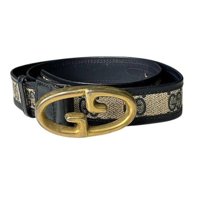 Black belt with gold buckle on a white background