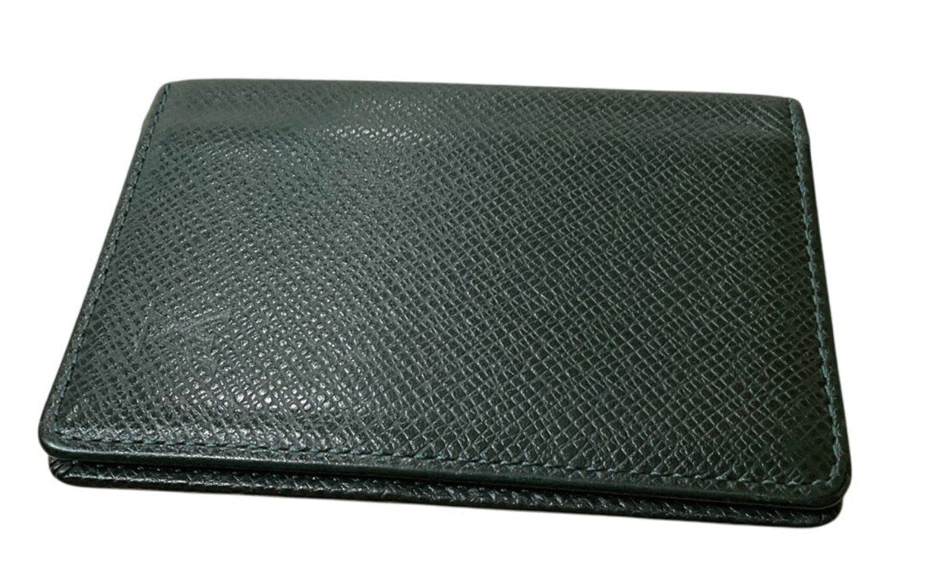 Green leather wallet on a white background