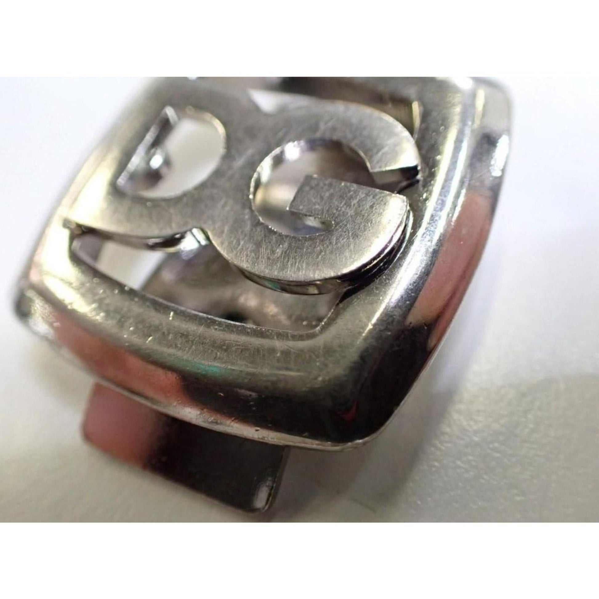 Metallic ring with a design on a white background