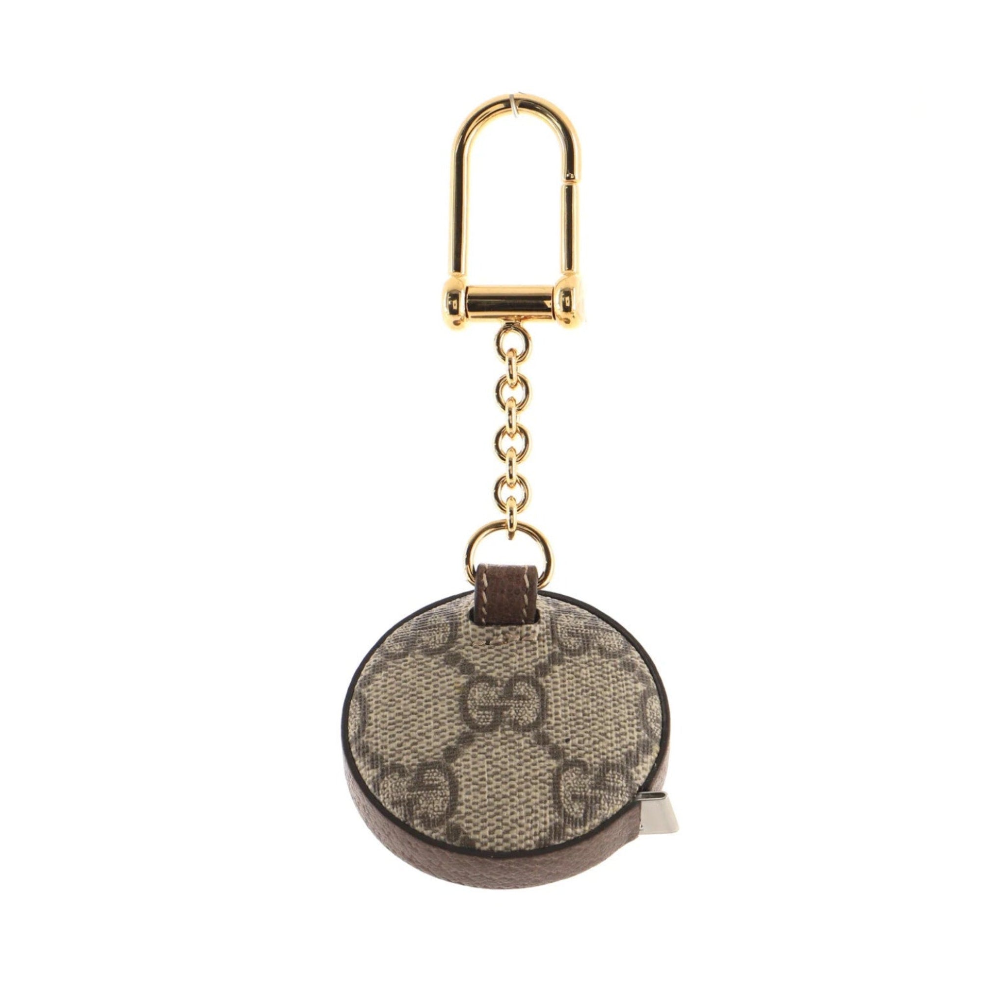 Round keychain with gold accents on a white background
