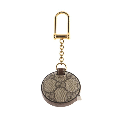 Round keychain with gold accents on a white background