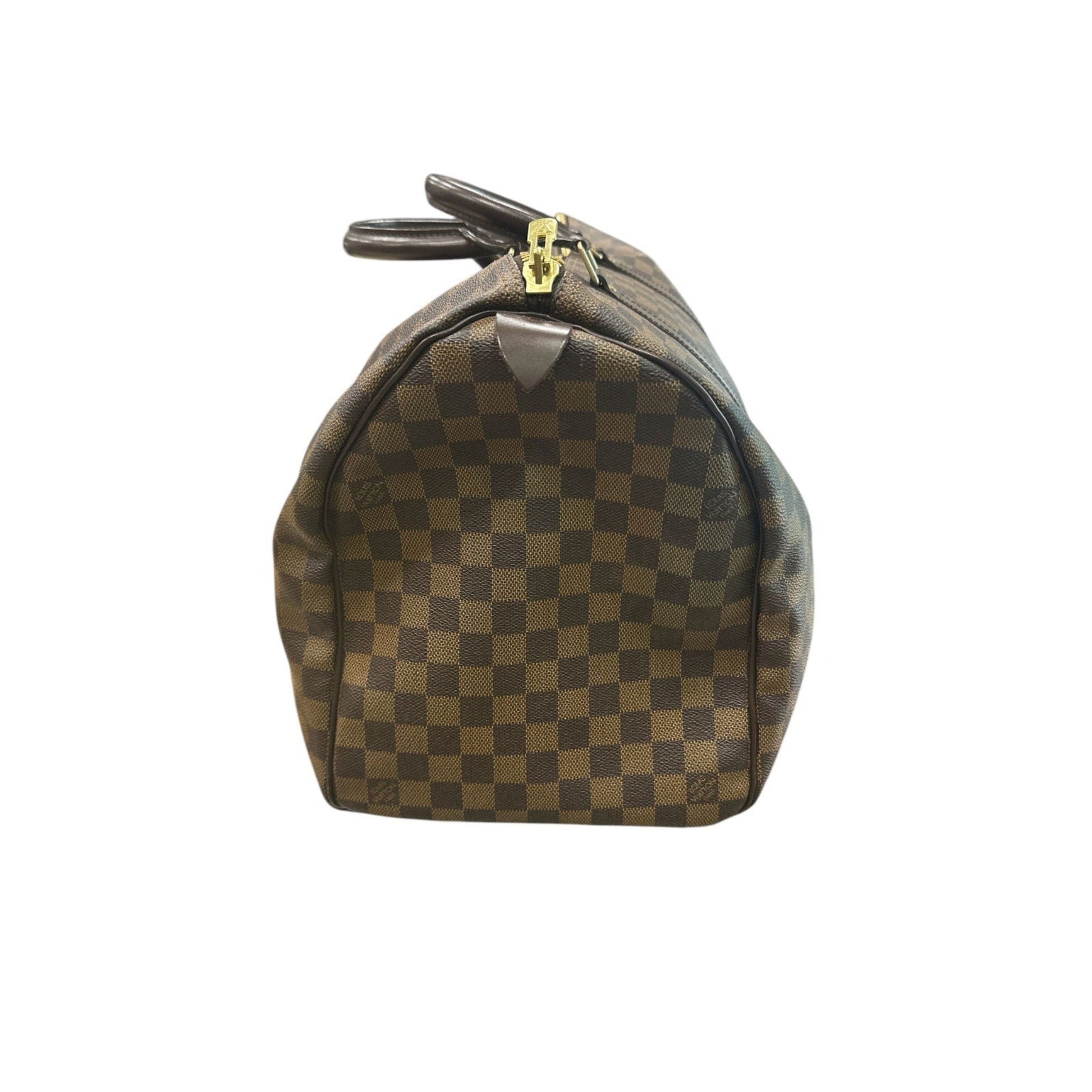 Brown checkered handbag with gold zipper on a white background