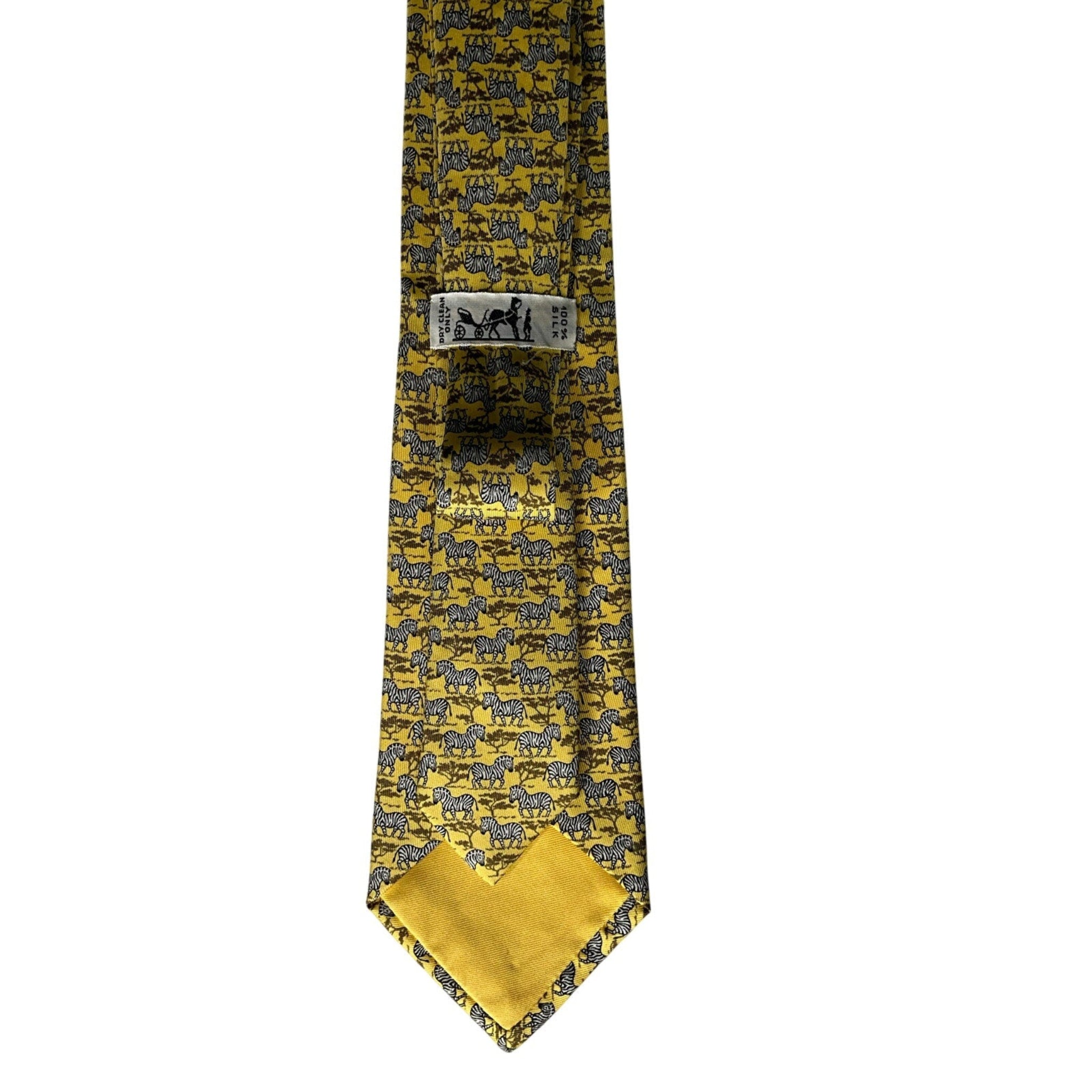 Yellow tie with black pattern on a white background