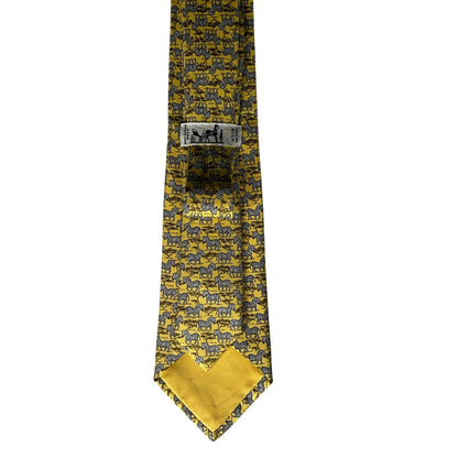 Yellow tie with black pattern on a white background