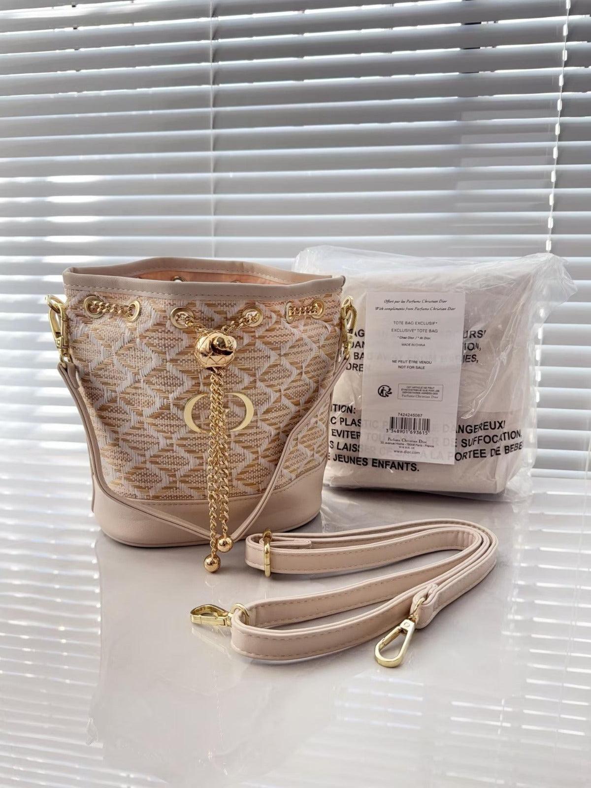 Woven Leather Bucket Bag with Chain Detail
