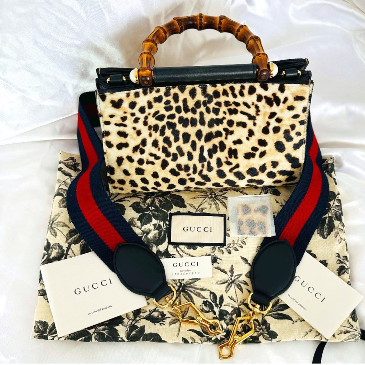 Authentic Gucci Nymphaea Leopard Calf Hair
Bag w/Bamboo Pearl Handles - Clairely Amazing